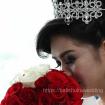 Bride posed with rouse bouquet 